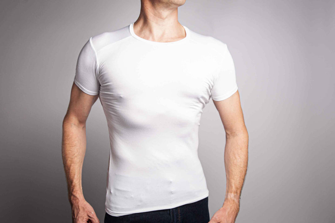 Picture of a man wearing a white crew neck undershirt