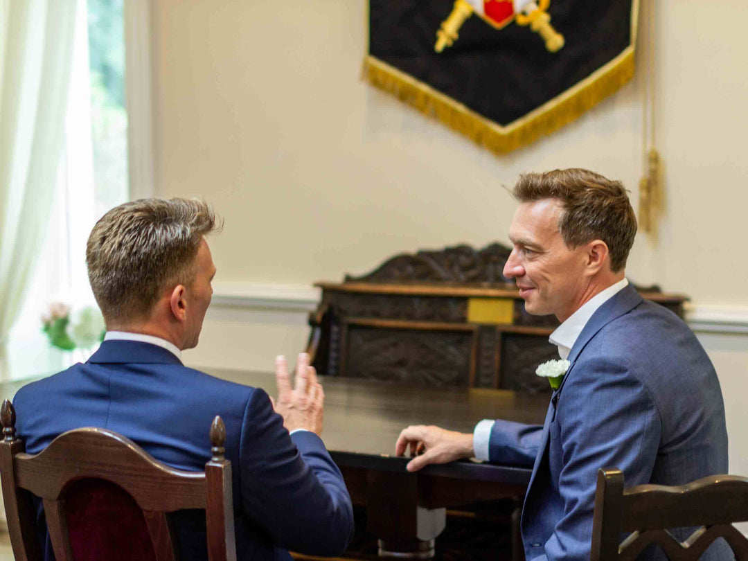 Two men at a wedding