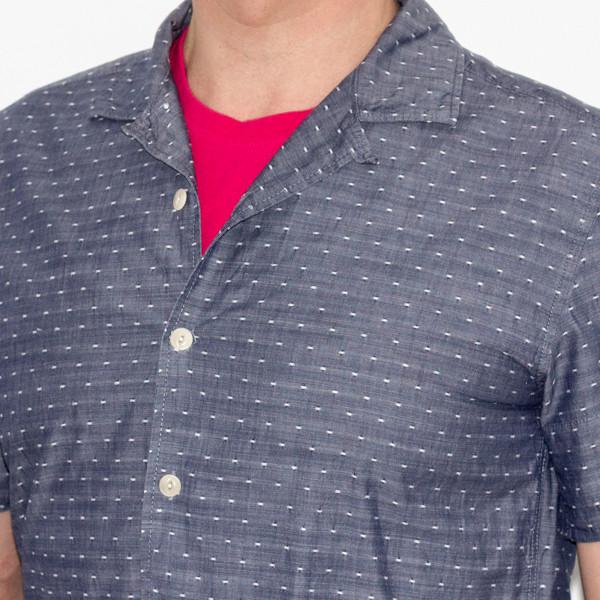 man wearing pink T shirt under shirt