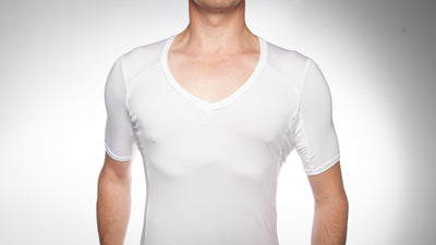 Picture of a man wearing an Oxford undershirt in white